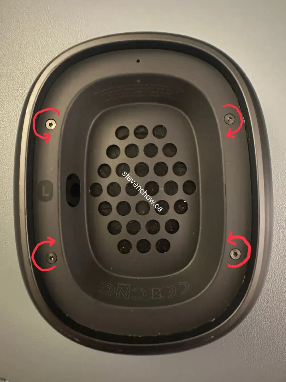 Step 1: Remove plastic cover by rotating each pentalope screw in the specified direction 90 degrees. If you imagine the magnets in each corner, these turns make sense.